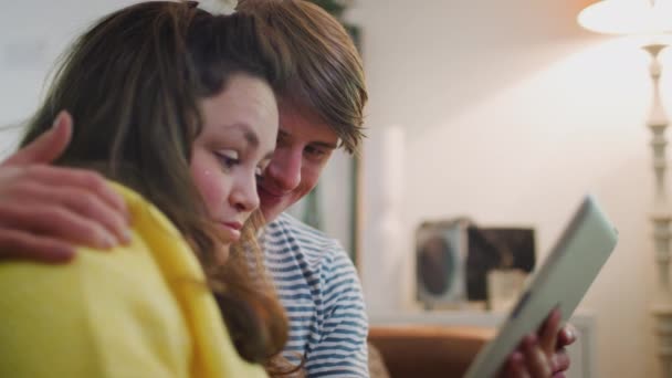 Young Downs Syndrome Couple Sitting Sofa Watching Movie Streaming Digital — Stock Video