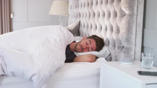 Man Asleep Bed Being Woken Alarm Voice Assistant Which Turns — Stock Video