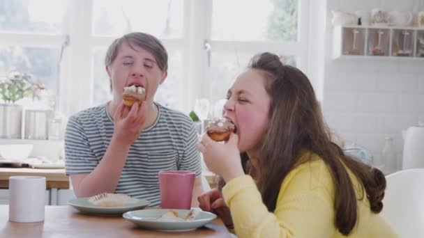 Young Downs Syndrome Couple Sitting Table Hot Drink Cakes Home — Stock Video