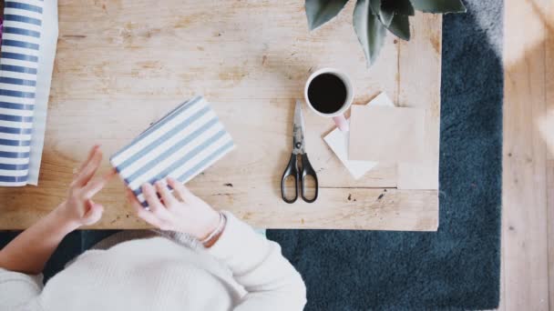 Overhead View Looking Woman Sitting Table Gift Wrapping Present — Stock Video