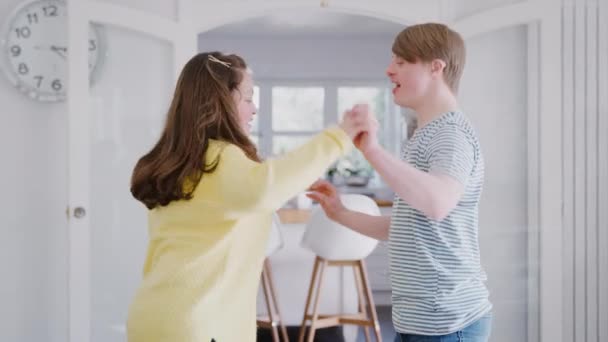 Young Downs Syndrome Couple Having Fun Dancing Home Together Shot — Stock Video