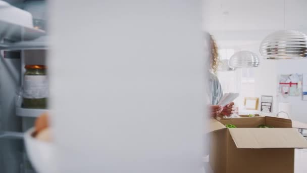 View Fridge Couple Unpack Online Food Delivery Shot Slow Motion — Stock Video