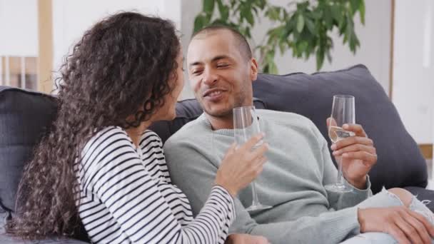 Couple Sitting Sofa Celebrating Champagne Move New Home Together Shot — 비디오