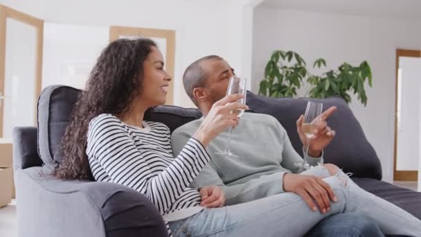 Couple Sitting Sofa Celebrating Champagne Move New Home Together Shot — 비디오