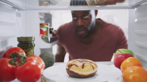 View Fridge Man Opens Door Picking Taking Bite Unhealthy Donut — Stock Video