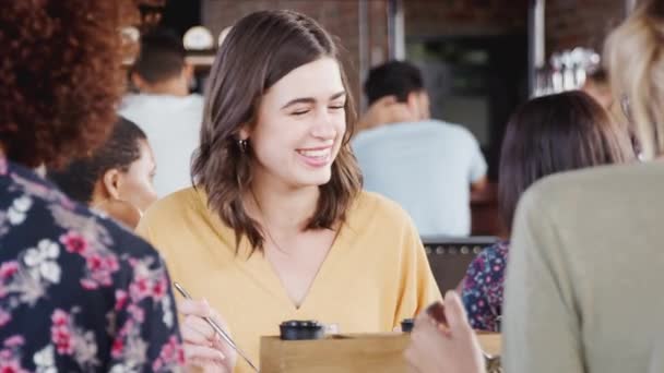 Group Friends Eating Meal Talking Busy Restaurant Shot Slow Motion — Stock Video