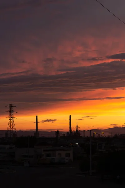 Beautiful sky at sunset with towering towers, lanterns, houses. High quality photo