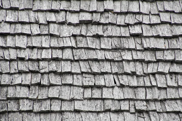 Natural roofing material. Aspen shingle - roofing board. Beautiful texture of the roof surface. Aircraft.
