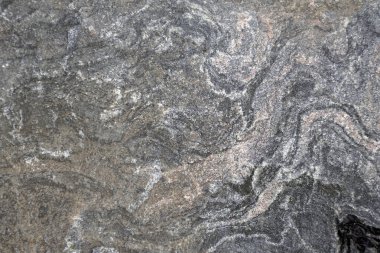 Taş dokusu. Parktaki büyük bir kayanın yüzeyi. Soyutlama. Geçmişi. Granit                               