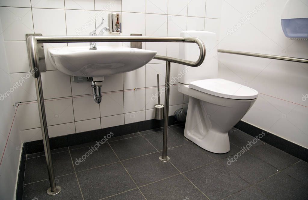 Handicapped Access Bathroom with Grab Bars and a Toilet