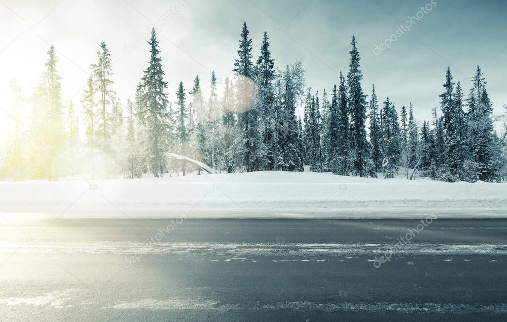 road in winter forest, sunset time