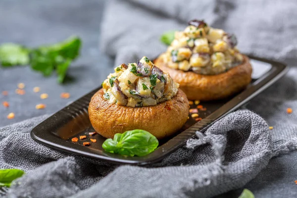 Baked mushrooms with minced eggplant and mushrooms.