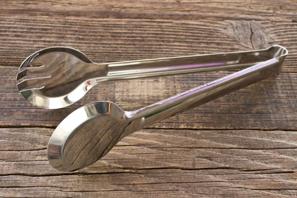 Serving Kitchen Tongs Wooden Background — Stock Photo, Image