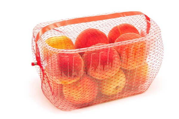 Peaches packaged for sale isolated on white — Stock Photo, Image