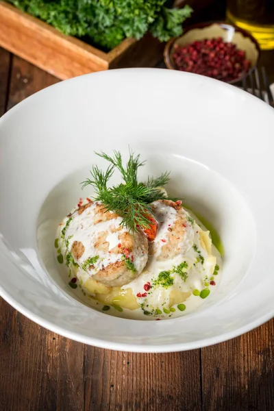 Muksun cutlets served in a white plate. Close-up shot in the decor — Stock Image Muksun Cutlets Served White Plate Close Shot Decor Royalty Free Stock Images