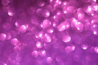 Pulların arka planı. Sequins arka planda. Pembe parlak arka plan. Parlayan ışıkları olan soyut, şen şakrak bir arka plan. Kumaş parlak renklerle parıldıyor. Moda kumaşları. 