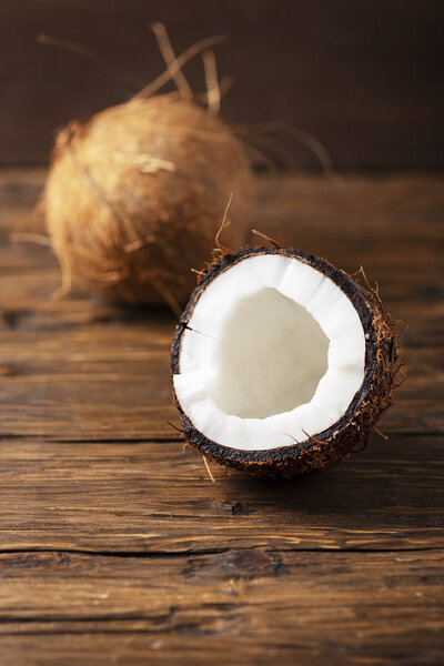 fresh coconut on wooden table, selective focus
