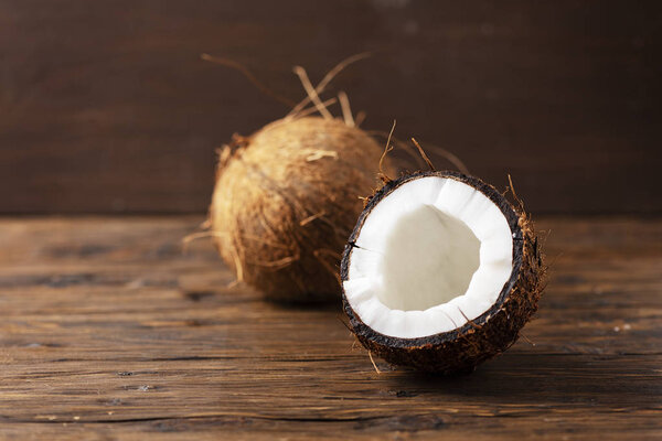 fresh coconut on wooden background, healthy food 