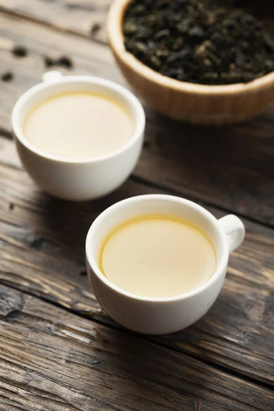 Two Cups Hot Green Tea Raw Tea Wooden Table Selective Royalty Free Stock Photos
