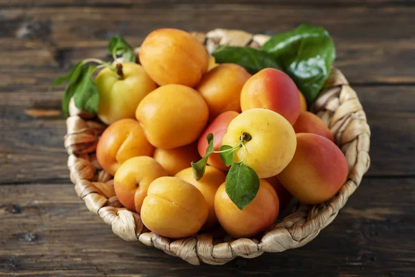 Sweet apricots on the wooden table — Stock Photo, Image