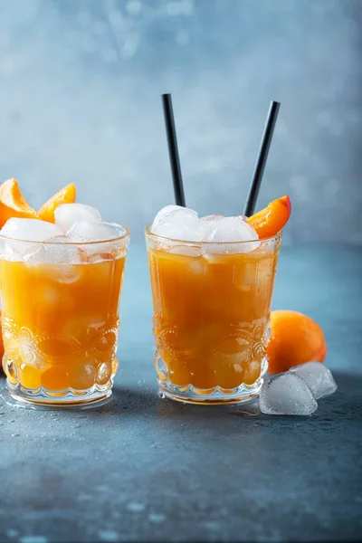 Summer juice with apricots and ice. Bar concept with copy space for your text
