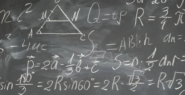 Math formulas on black board — Stock Photo, Image