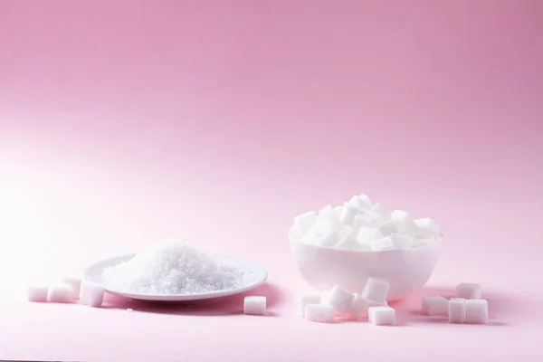 Suiker op roze achtergrond — Stockfoto