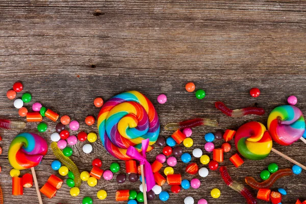 Colorful candies on wood — Stock Photo, Image