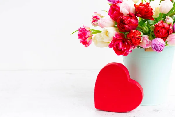 Fresh tulips flowers with heart — Stock Photo, Image