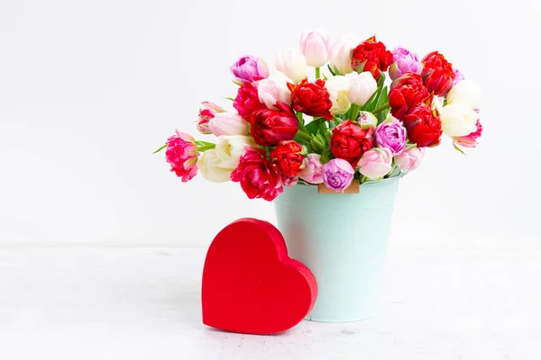 Fresh tulips flowers with heart — Stock Photo, Image