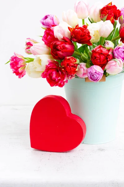 Fresh tulips flowers with heart — Stock Photo, Image