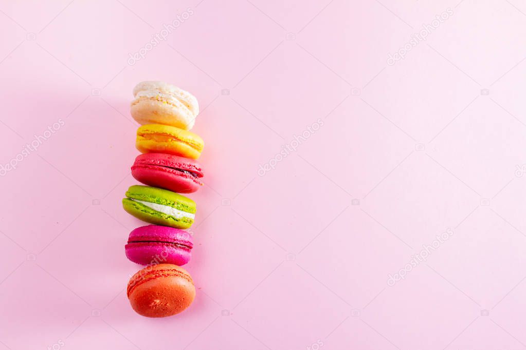 Macaroons cookies on pink