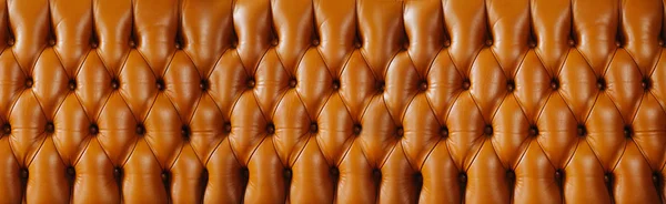 En brun yta av läder baksidan av vintage soffan. — Stockfoto