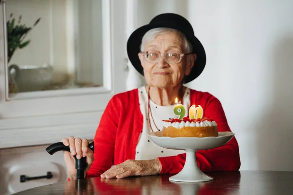 Kind grandmother is celebrating her 90th birthday at home. — Stock Photo, Image