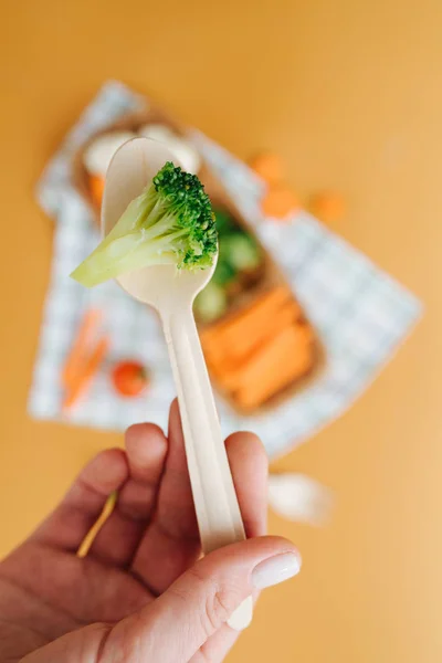 Broccoli on a wooden spoon — Stock Photo, Image