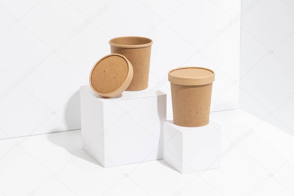 Disposable, recyclable plastic-free bamboo pots over white background