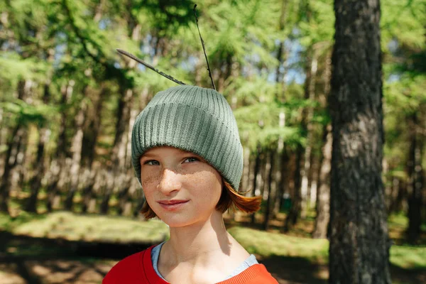 Portrait Freckled Ginger Girl Forest Feathers Her Cap Blurred Surroundings — Stock Photo, Image