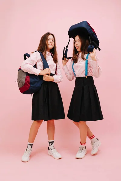 Beautiful Little Twin Schoolgirls Happily Posing Backpacks Looking Camera Low — Stock Photo, Image