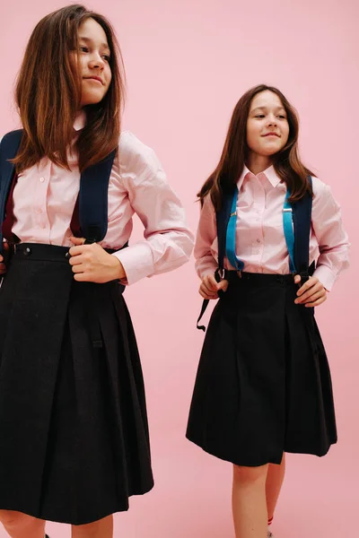 Beautiful Little Twin Schoolgirls Happily Posing Backpacks Low Angle Pink — Stock Photo, Image