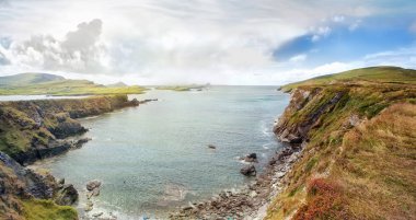 Panoramic landscape with a rocky ocean shore in a southwest Ireland. Bray Head Car Park. clipart
