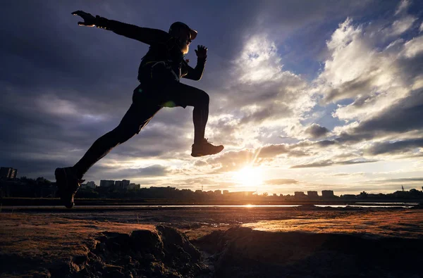 Silhouette of running man — Stock Photo, Image