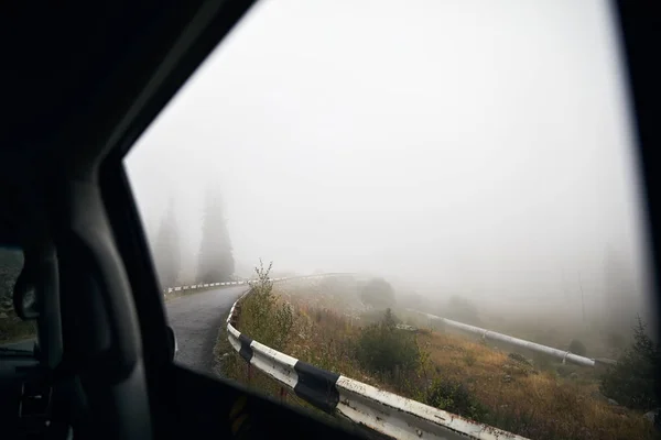 Foggy road from the car