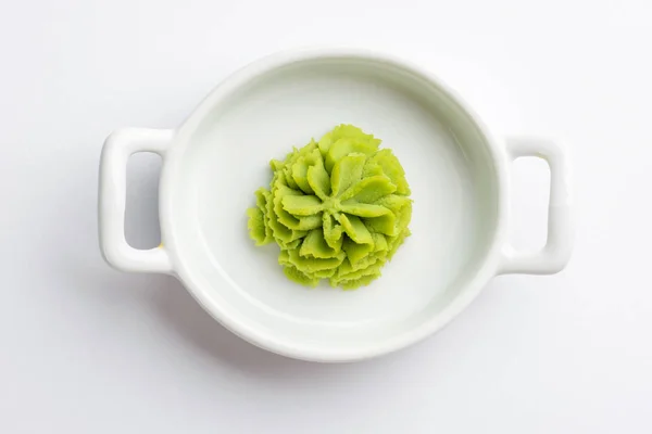 Portion of wasabi in a white gravy boat. — Stock Photo, Image