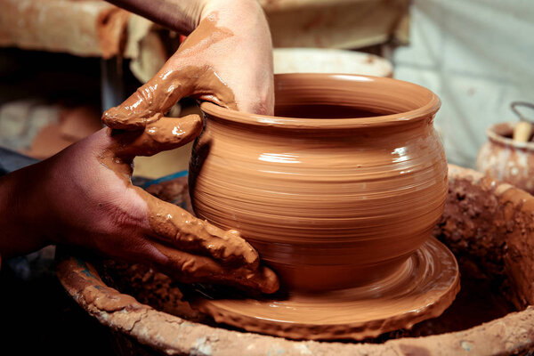Potter at work. Workshop place.