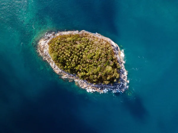 Little island in ocean.