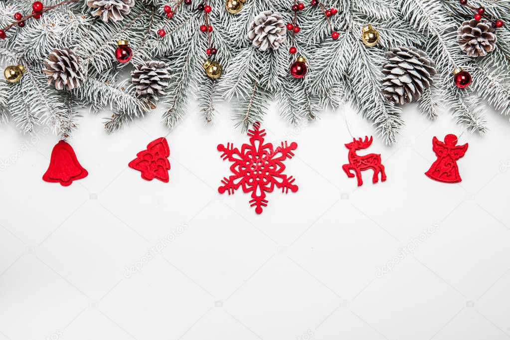 Christmas card. White background with snow fir tree and decoration. Top view with copy space for your text