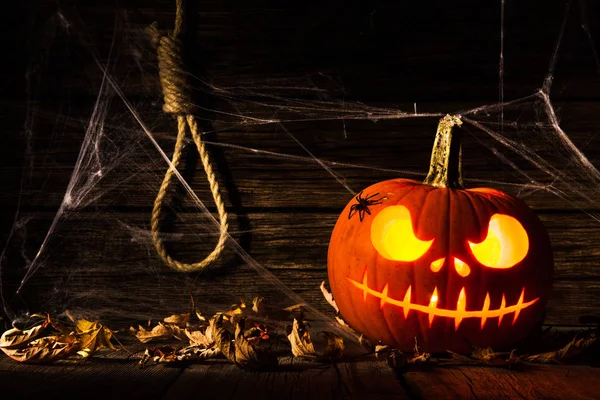 Halloween dýně hlava jack na dřevěném pozadí — Stock fotografie