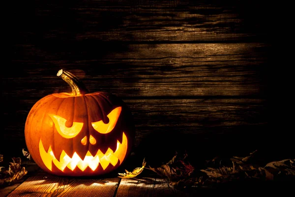 Halloween zucca testa jack su sfondo di legno Fotografia Stock