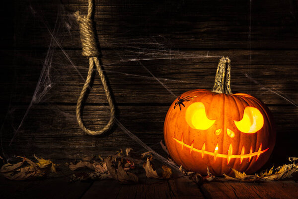 Halloween pumpkin head jack on wooden background