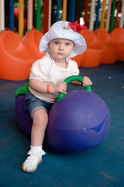 Baby Sitting Large Eggplant Looks Camera Serious Look She Playground — Stock Photo, Image